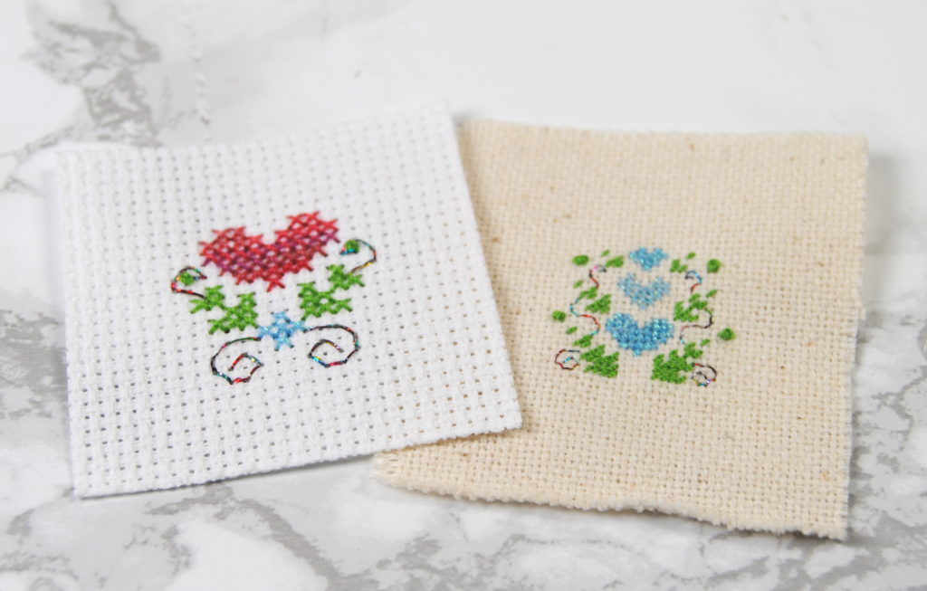 Two fully stitched cross stitch designs