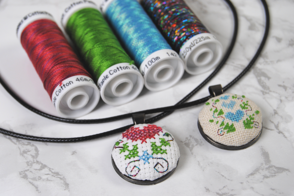 Two cross stitch pendants using Sulky Petites thread.