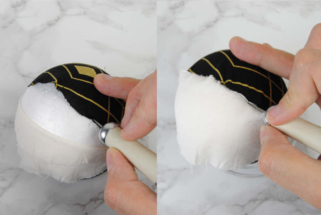 Using an exacto knife to carefully tuck the edges of the fabric into the foam