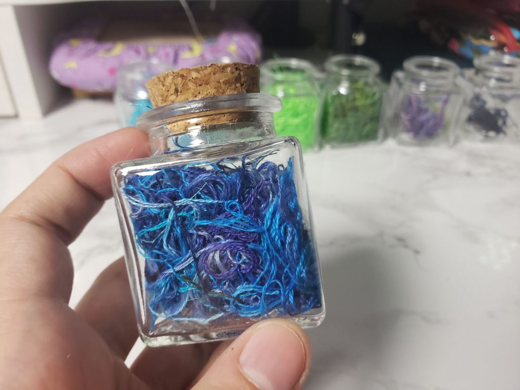 A potion bottle full of blue thread ORTs.