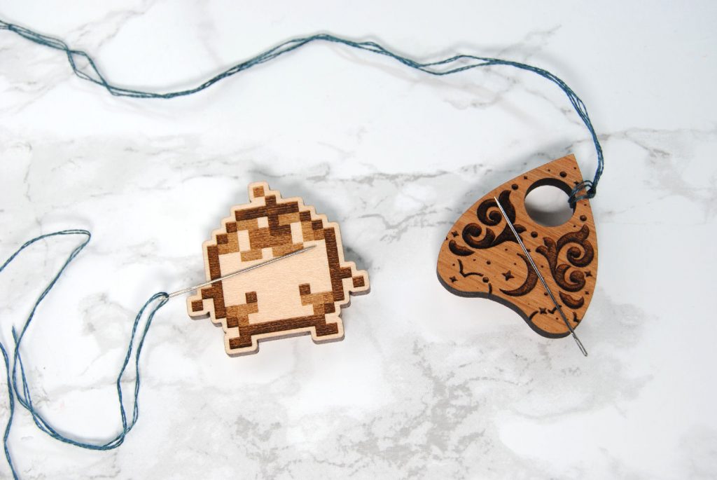 Junimo and Planchette wooden needle minders by AHareAffair