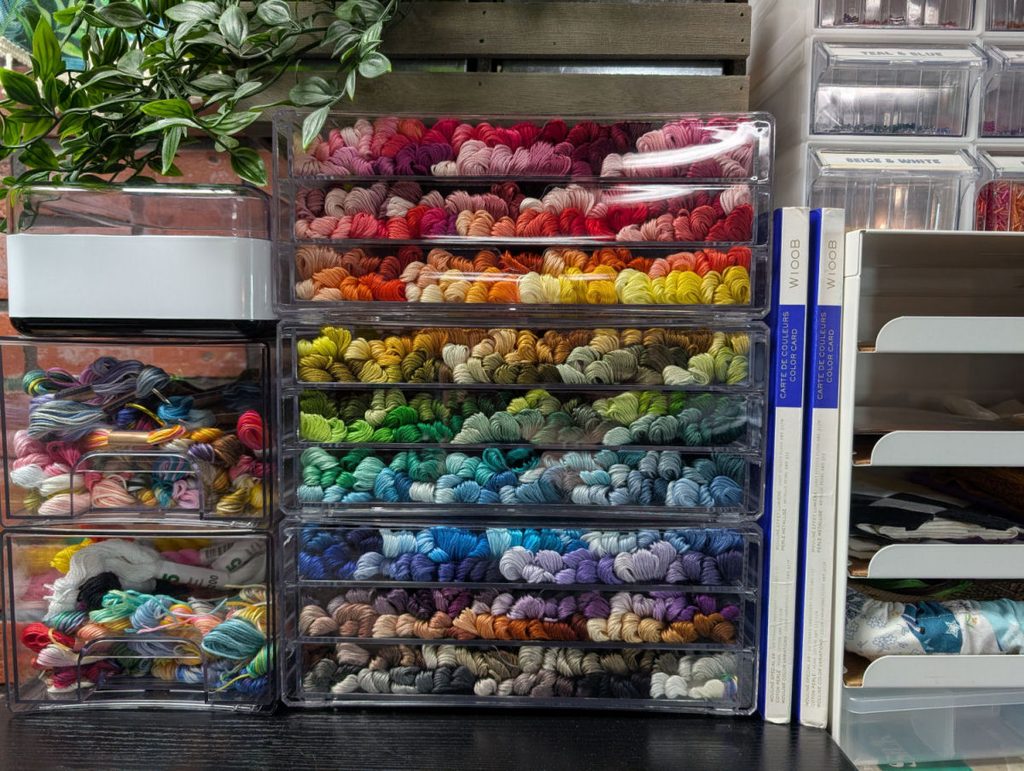 Acrylic drawers full of Cosmo brand embroidery thread skeins