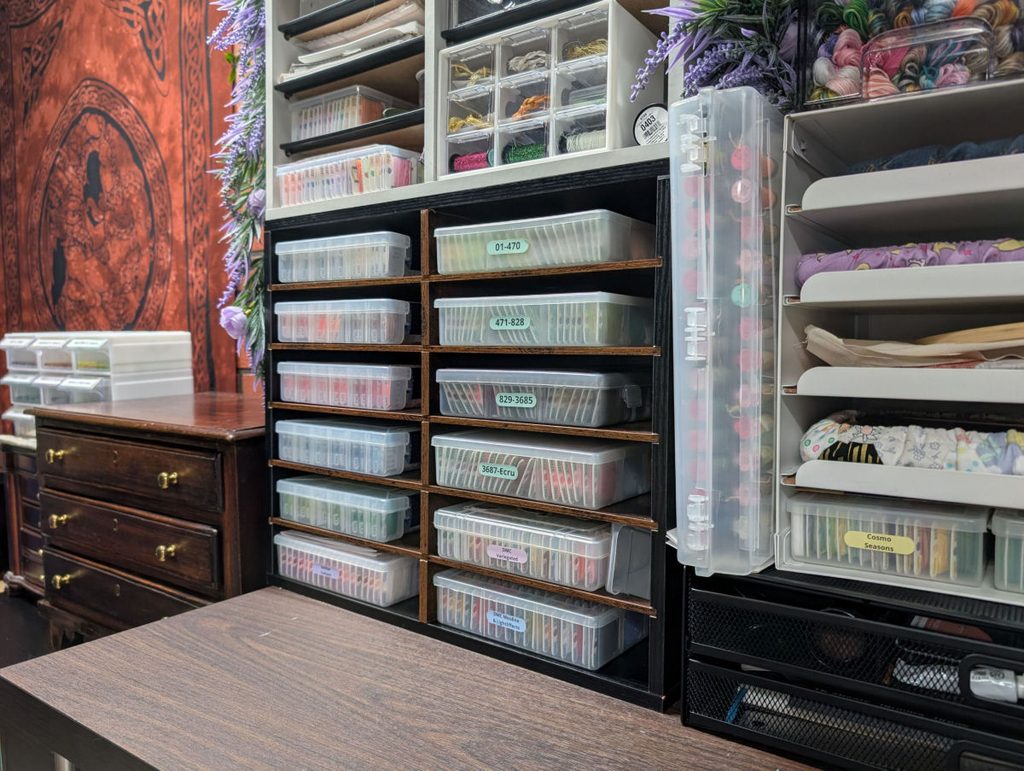 A mail sorter being used to store embroidery thread in bobbin boxes