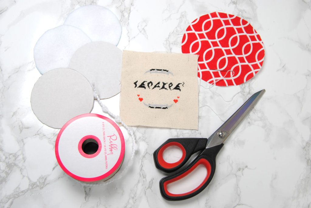Materials for making a round ornament.