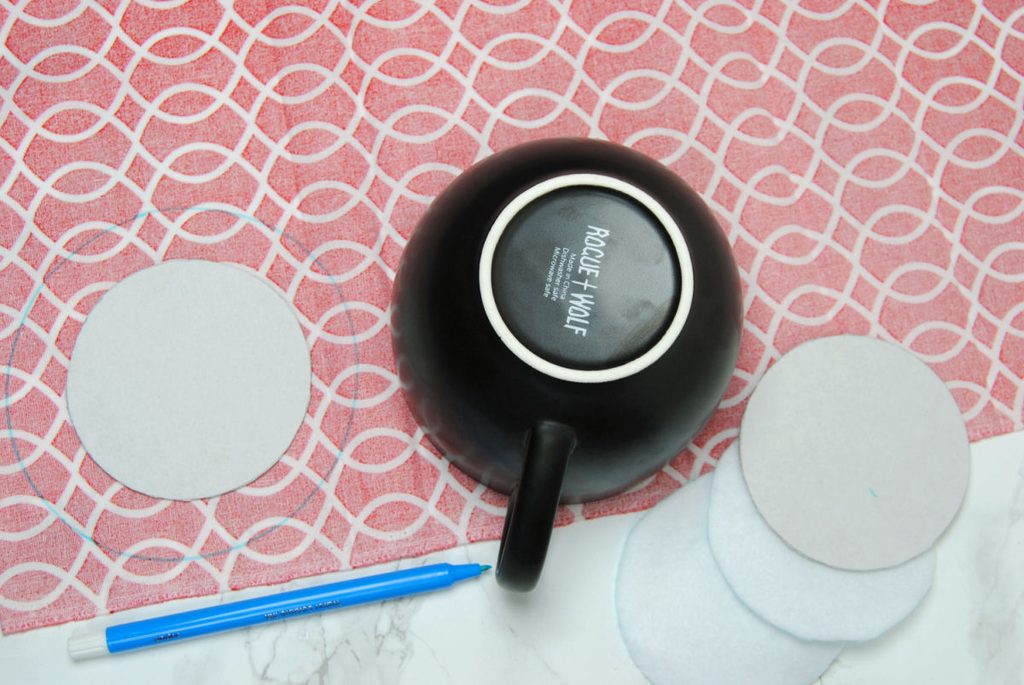 Using a mug to trace perfect circles onto fabric.