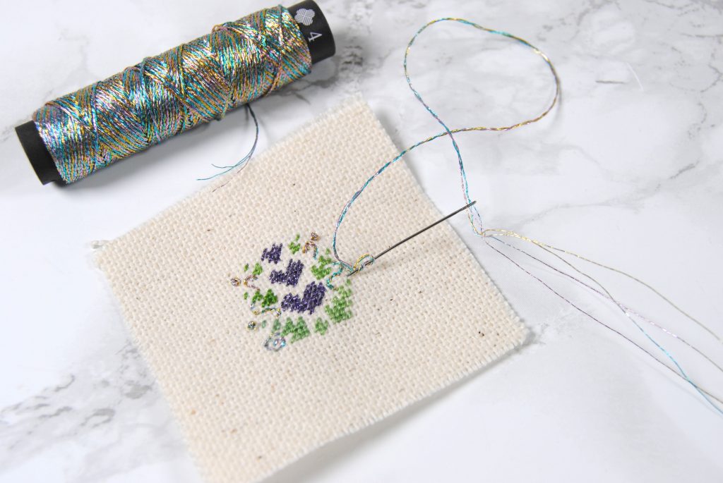 A nearly complete petite point design using Lecien Cosmo Seasons and Nishikiito thread.