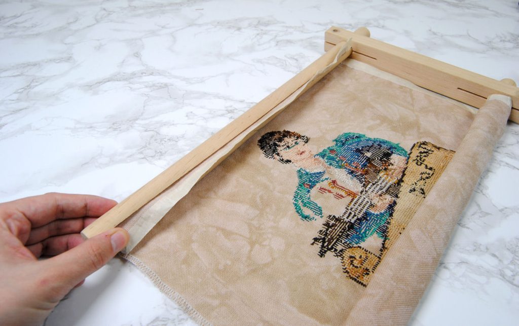 Demonstration of loading a cross stitch into split bar scroll frame.