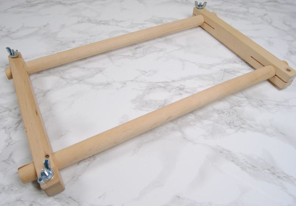 A wooden scroll frame with split bars.