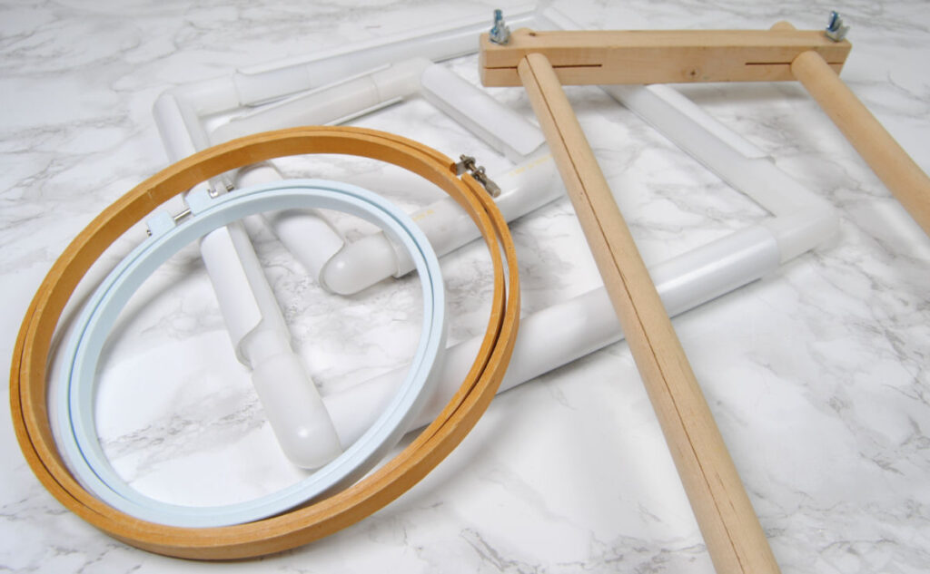 An array of embroidery hoops, Q snap frames, and scroll frames.