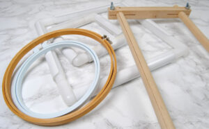 An array of embroidery hoops, Q snap frames, and scroll frames.