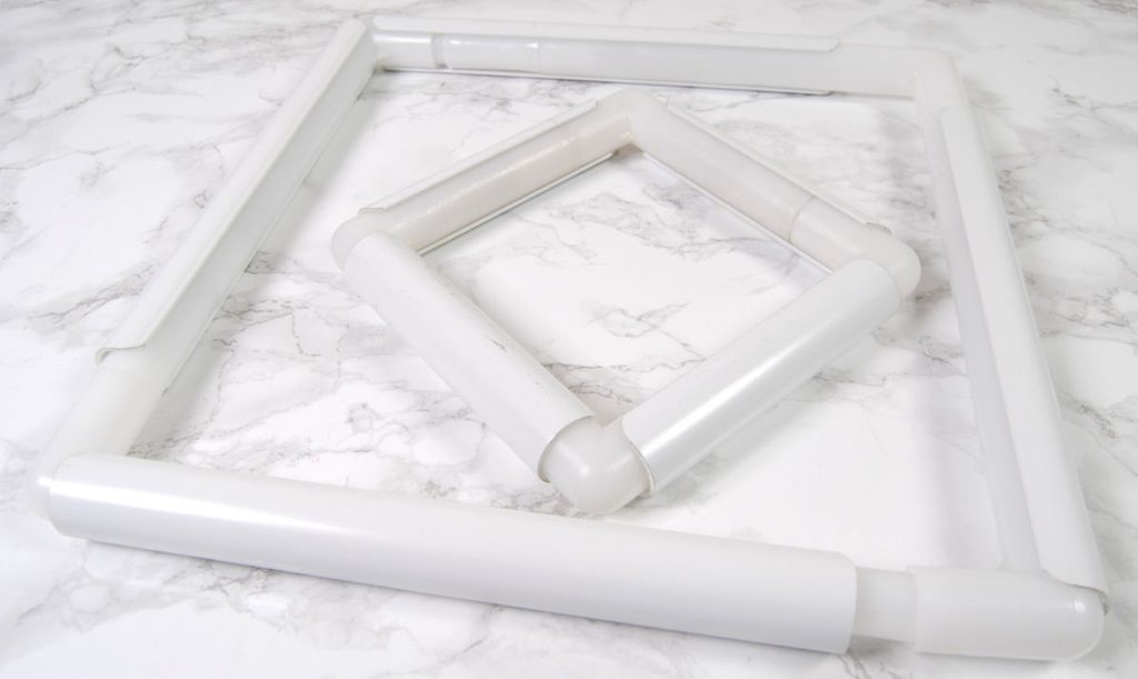 Two different sizes of Q-snap branded snap frames.