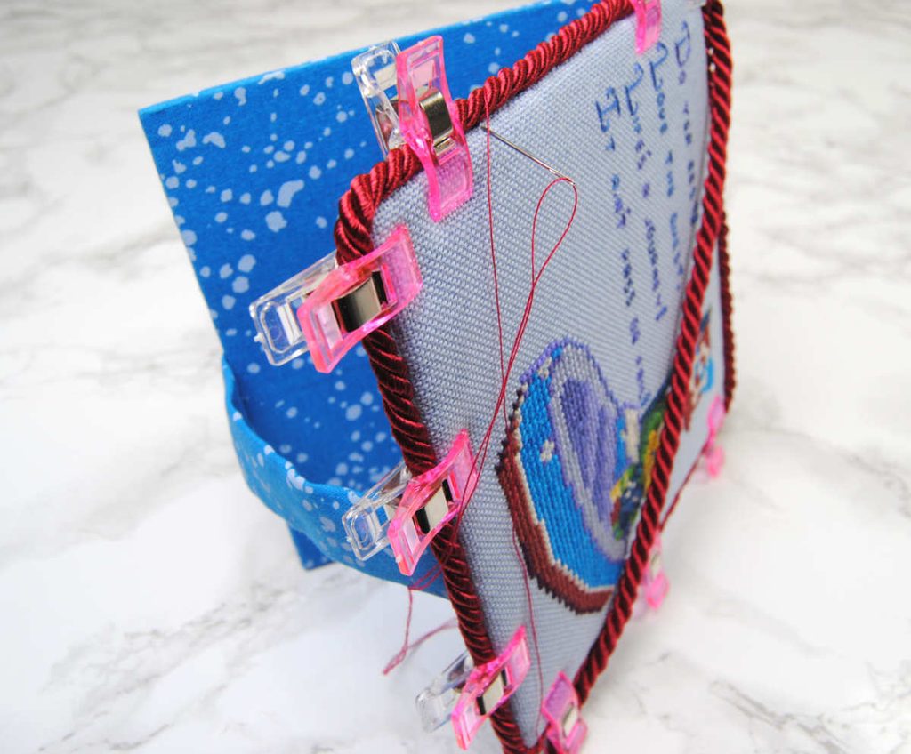 Demonstration of attaching cording to your flatfold with sewing thread.