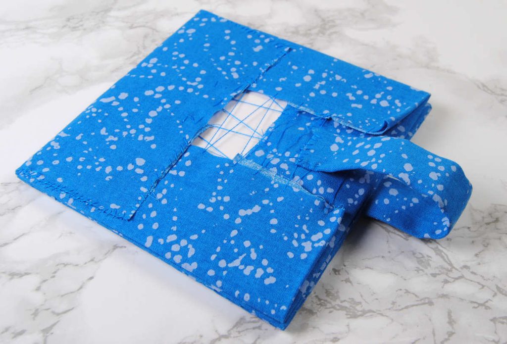 Sewing the fabric strip onto the inner side of your fabric square.