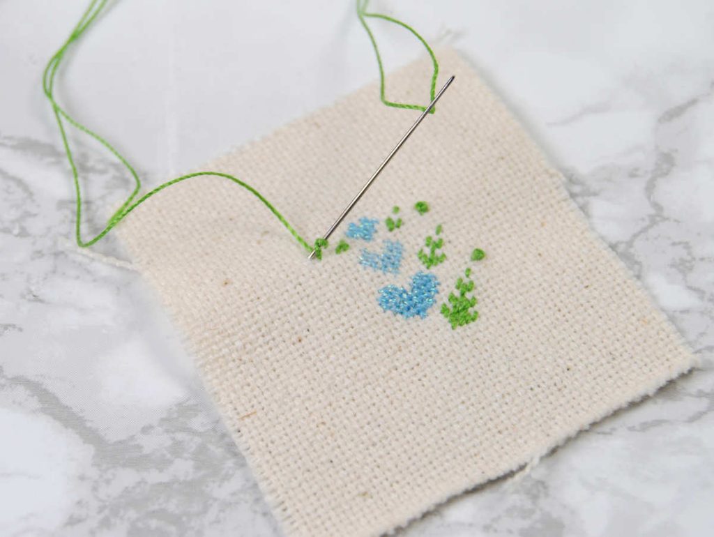 Demonstration of a french knot done with Sulky petites thread.