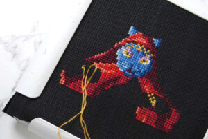 Cross stitch wip on black aida.