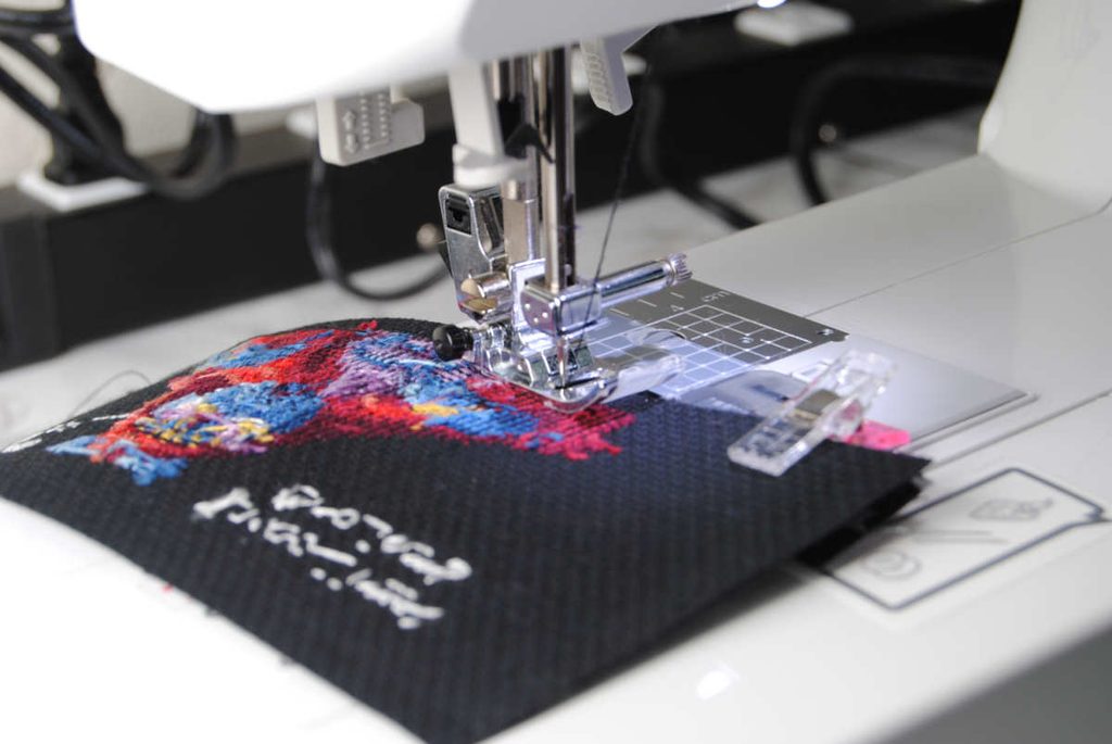 Sewing along the grooves of the aida.