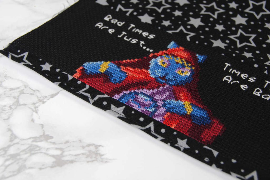 Top stitching along a cross stitch switch dock cover.