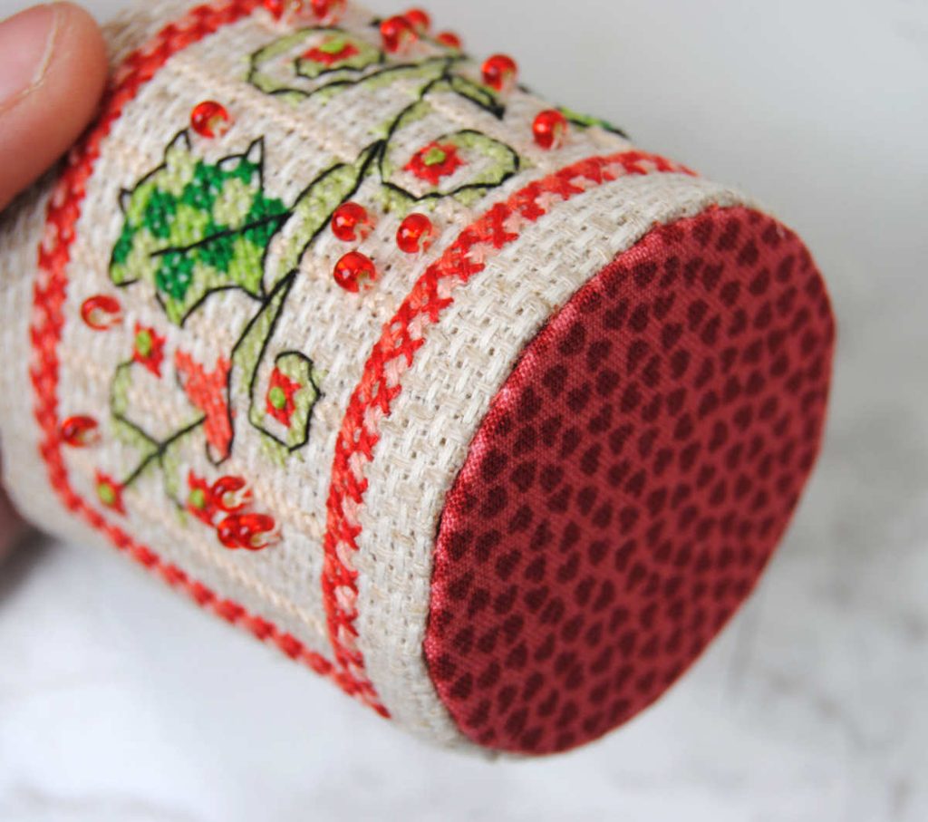 Close up of the bottom of a pin drum that was sewn on using the ladder stitch.