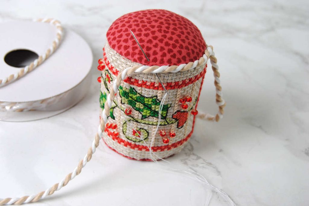 Demonstration of sewing braided cording to edge of pin drum.