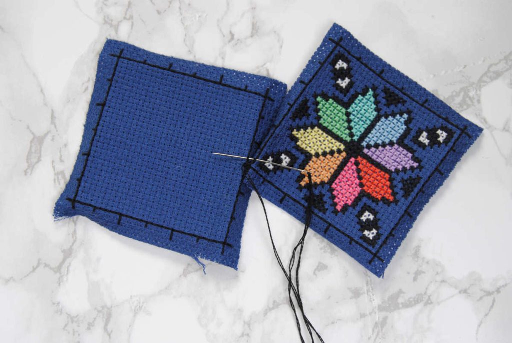 Showcasing stitching under the backstitch, rather than through the fabric.
