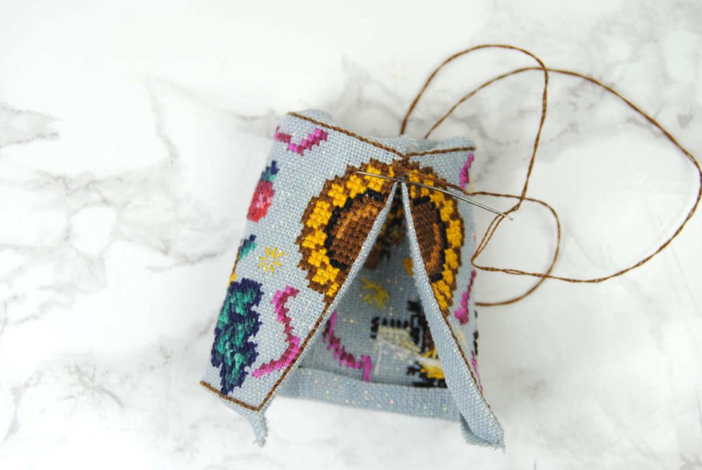 Begin stitching the two short ends of your rectangle together sewing under the backstitch.