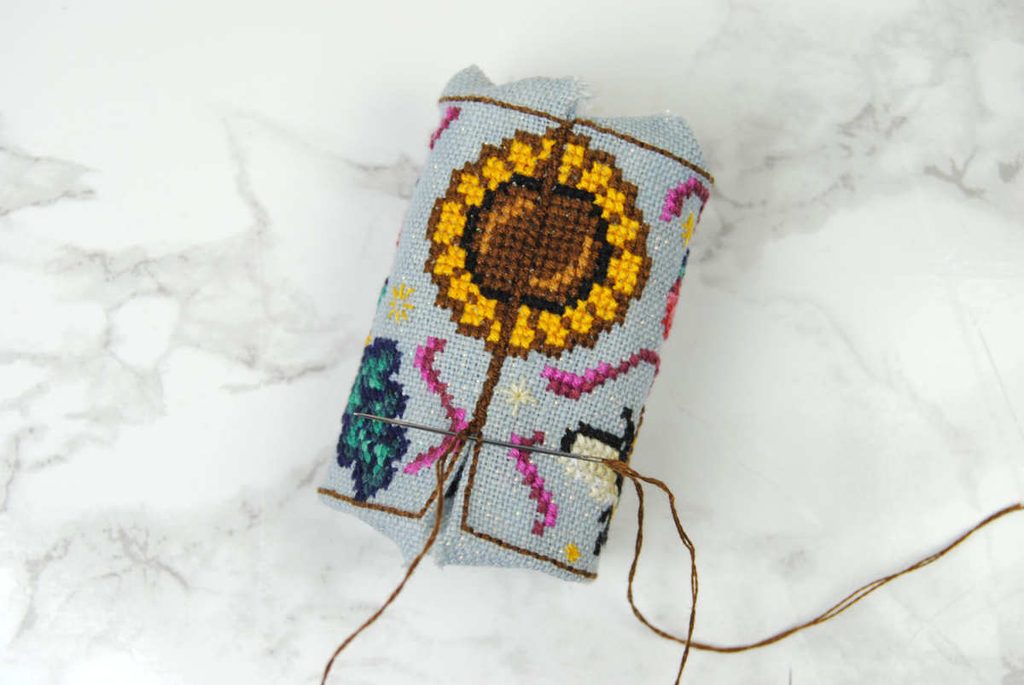 Continue stitching under the backstitch, sewing the two ends of your rectangle together.