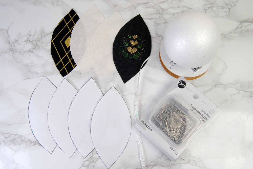 Layout of materials needed for a fabric ornament, listed below.