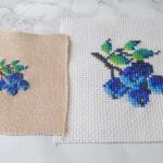 Comparing the same blueberry pattern done in both cross stitch and petit point.
