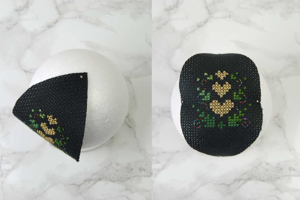 Demonstrating pinning the first lens into the styrofoam ball