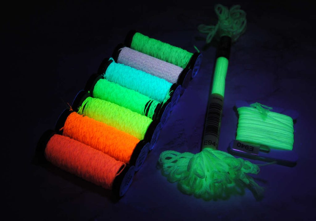Comparing the difference of glow strength between kreinik and DMC glow in the dark threads under blacklight.