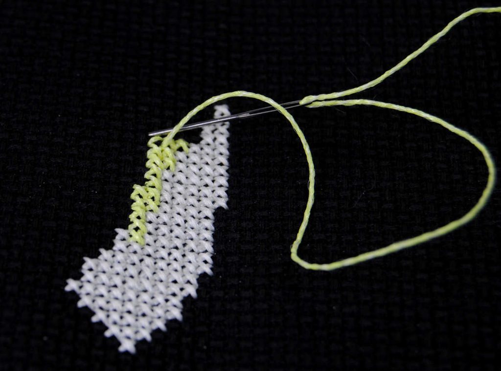 Demonstration of stitching with yellow kreinik #8 glow in the dark thread. 