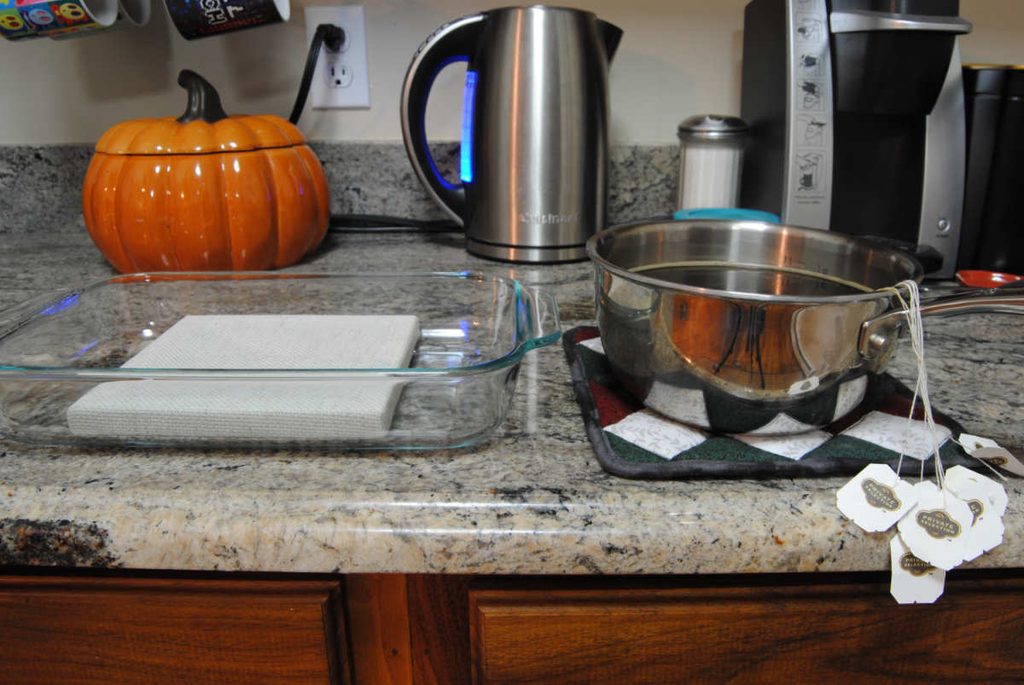 Waiting for overbrewed tea to cool down a bit before soaking fabric in it.