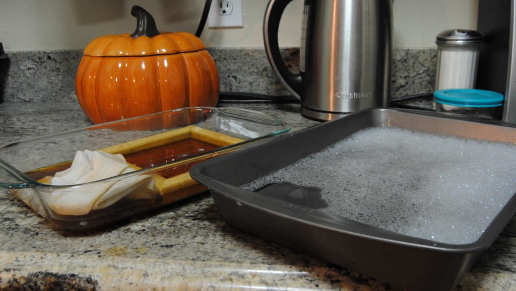 Prepare a container of lightly soapy water to rinse your fabric in.