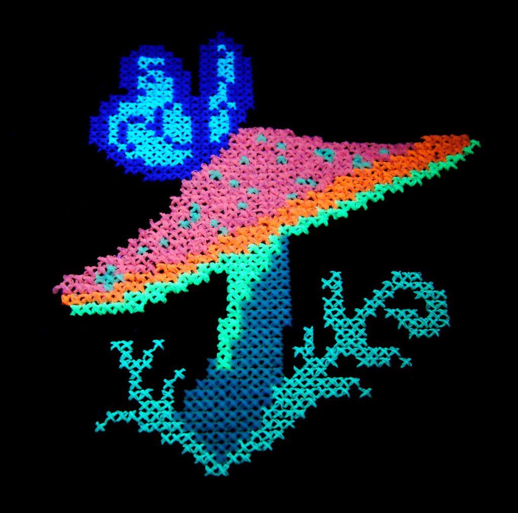 Showcasing how some DMC embroidery thread is UV reflective and glows under blacklight.