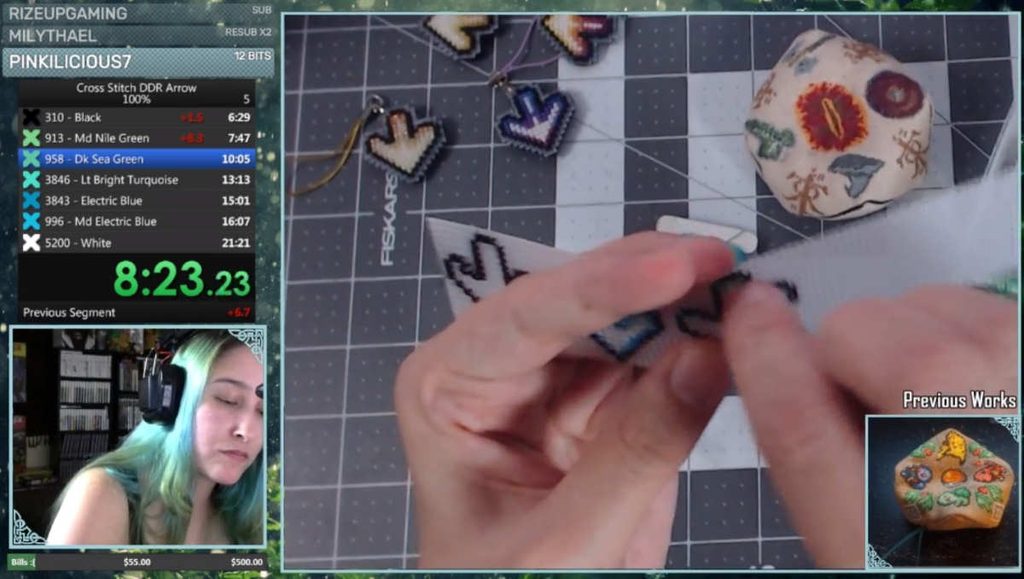 Screenshot from a livestream of a cross stitch speedrun