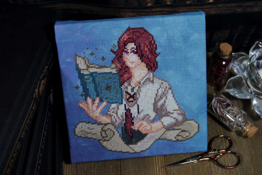 A cross stitch of a red haired wizard.