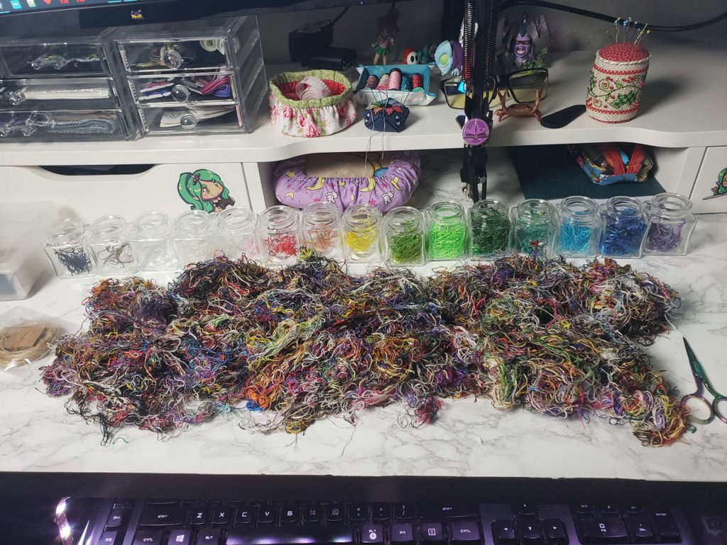 Siri's desk, completely covered in ORTs and a number of jars to organize them into.