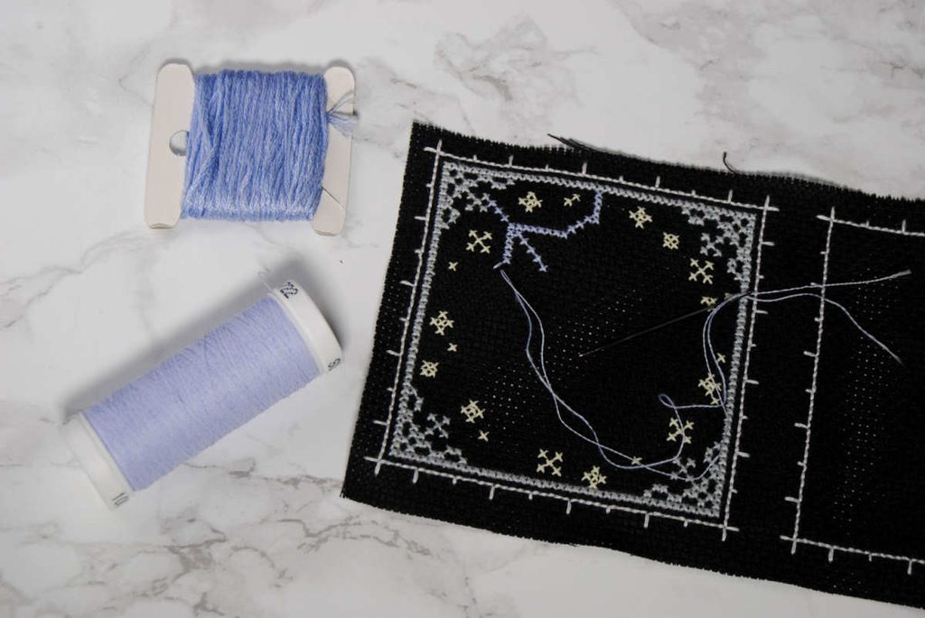 Example stitching with blended strands of DMC and Sulky Glowy.
