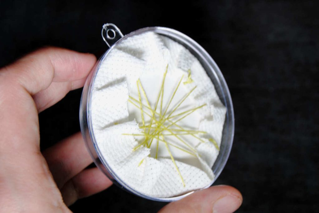 Testing to make sure your fabric wrapped disc still fits in your ornament.