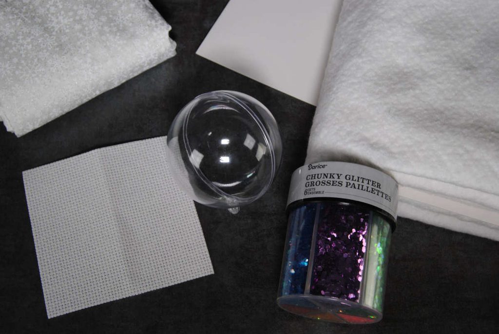 materials for assembling a snowglobe ornament, listed below