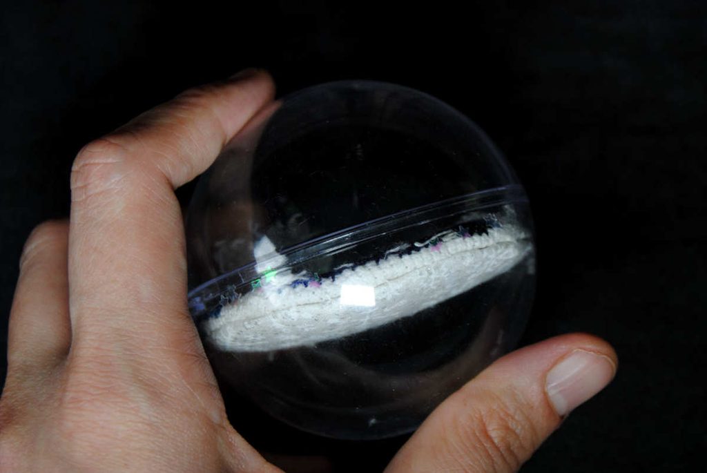 Side view of a snowglobe ornament.