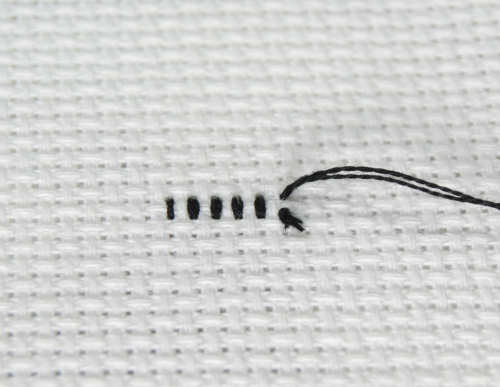 Example of the back of a cross stitch using the knot thread start.