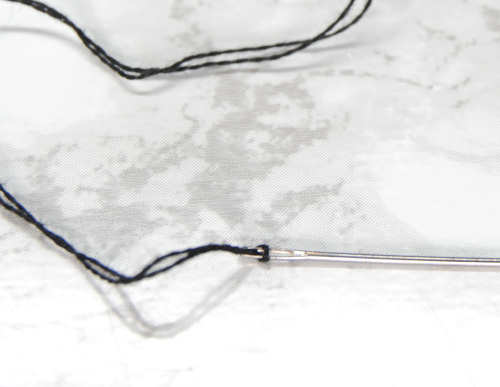 Pull your loop tight at the end of your needle.