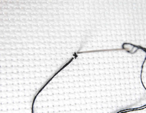 Stitch a normal cross stitch over your beginning pin stitch to cover it.