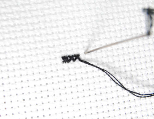 Comparing subsequent cross stitches with the slightly bulkier pin stitch.