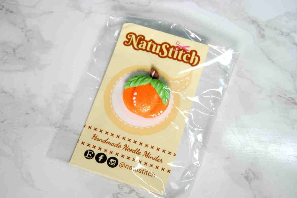 A pumpkin needle minder made from clay by NatuStitch