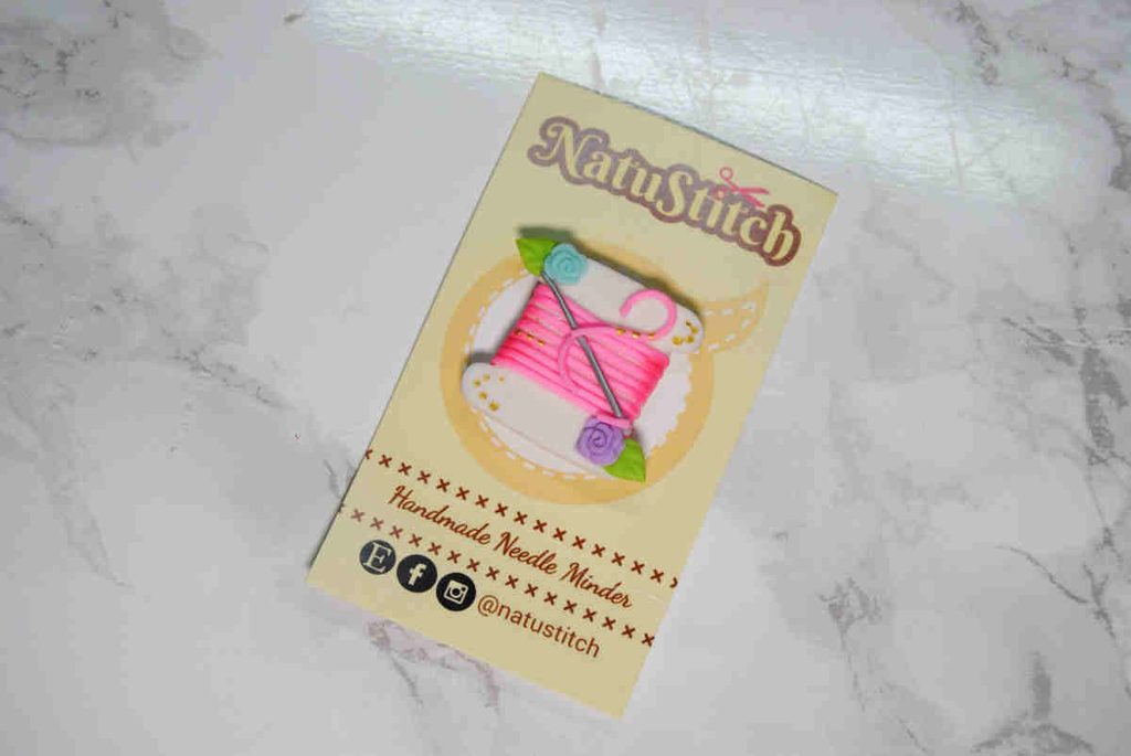 A thread bobbin needle minder made from clay by NatuStitch