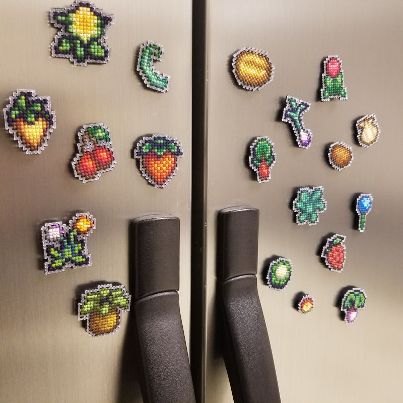 Shot of a refrigerator covered in cross stitched stardew crop magnets