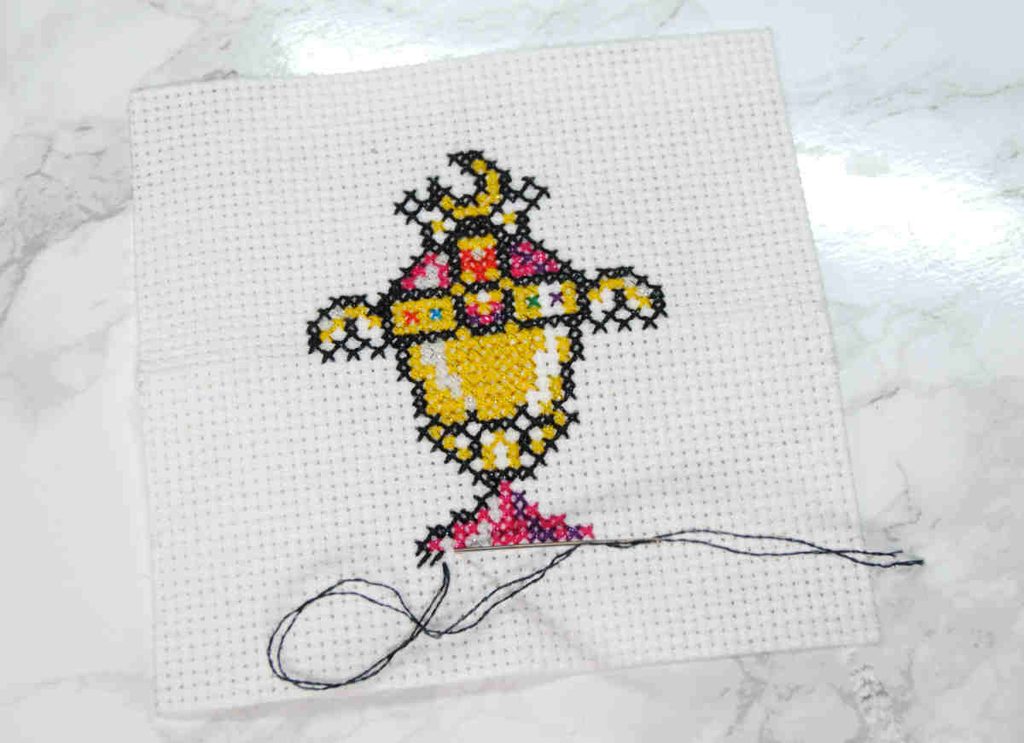 partially stitched cross stitch showing the coverage of 2 strands Mouliné Étoile