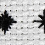 Stitched examples of two variations of the diamond eyelet.